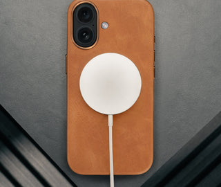 MagSafe charger attached ot the Tan Leather Bumper Case for iPhone 17