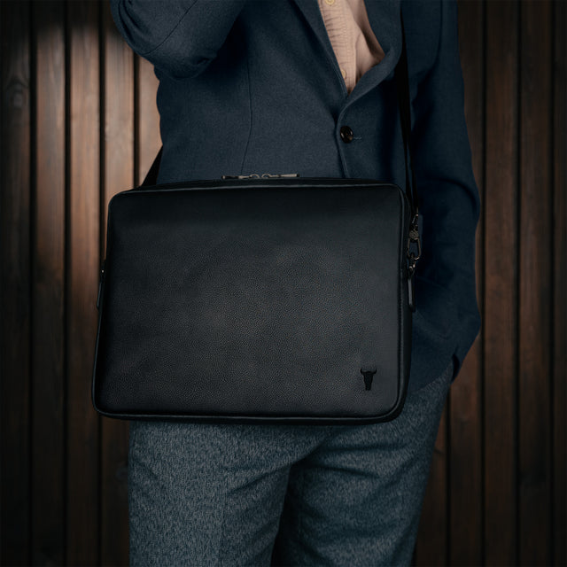 Removing laptop from the Black Leather Messenger Bag