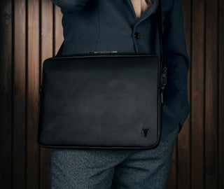 Removing laptop from the Black Leather Messenger Bag