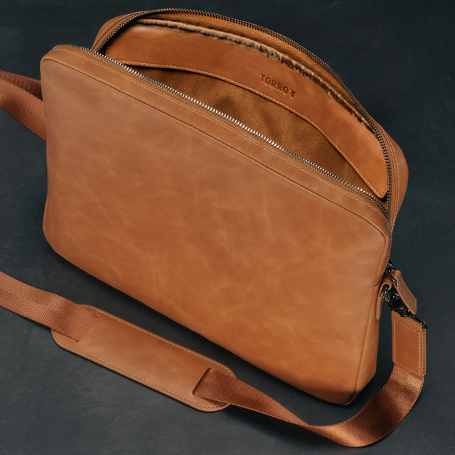 Inner protective flap on the Tan Leather Messenger Bag