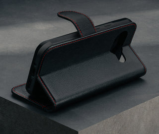 Stand feature of the Black with Red Detail Leather Wallet Case for Google Pixel 9