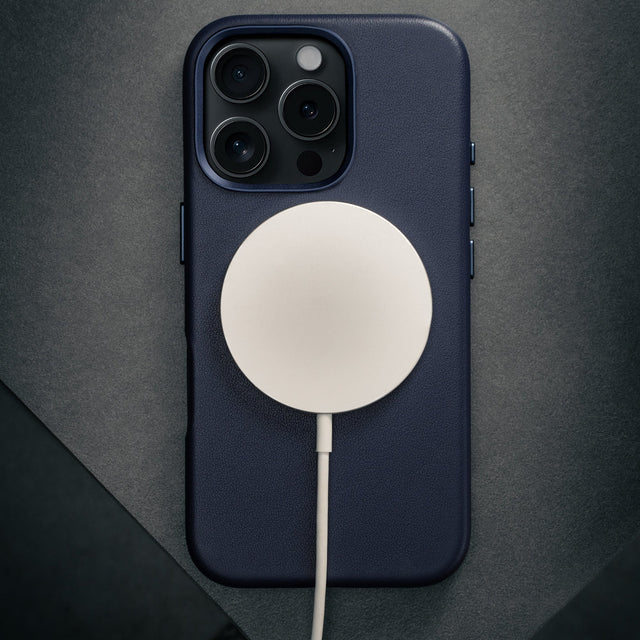 MagSafe charger attached to the Blue Leather Slimline Bumper Case for iPhone 16 Pro Max