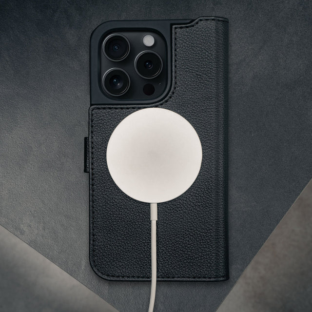 MagSafe charger connected to the Black Leather Case for iPhone 16 Pro Max