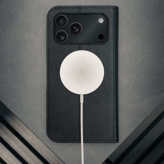 MagSafe charger attached to the Black Leather Case for iPhone 17 Pro Max