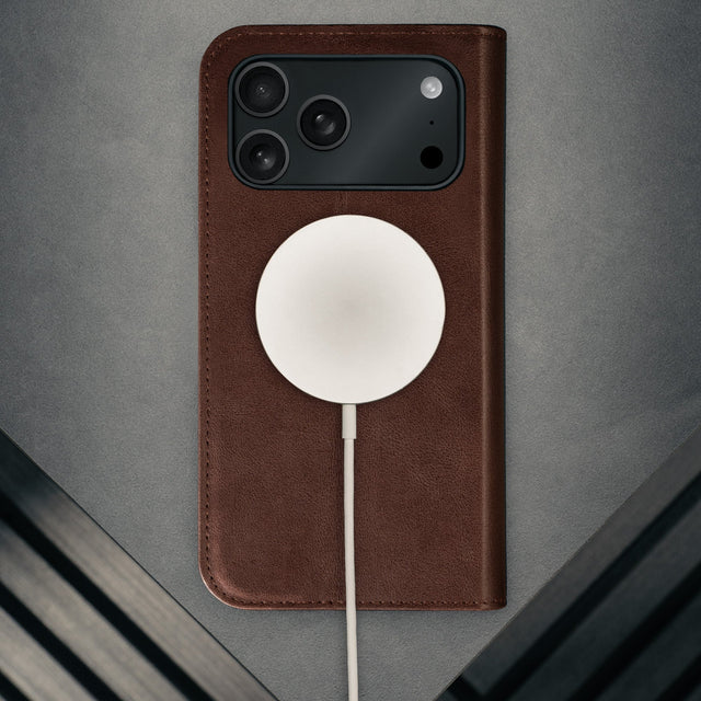MagSafe charger attached to the Dark Brown Leather Case for iPhone 17 Pro