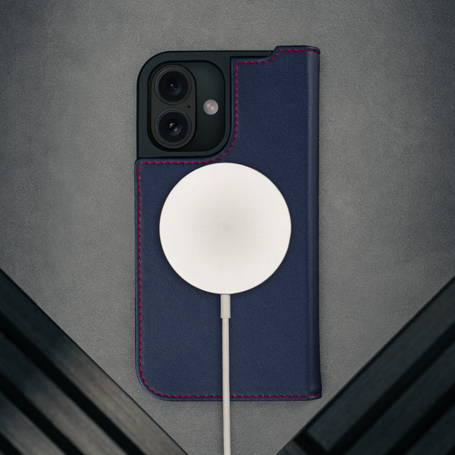 MagSafe charger attached to the Navy Blue Leather Case for iPhone 17