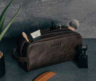 Toiletry items in the Dark Brown Leather Wash Bag