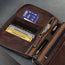 Zipped coin pocket and storage slots in the Dark Brown Leather Solo Travel Wallet