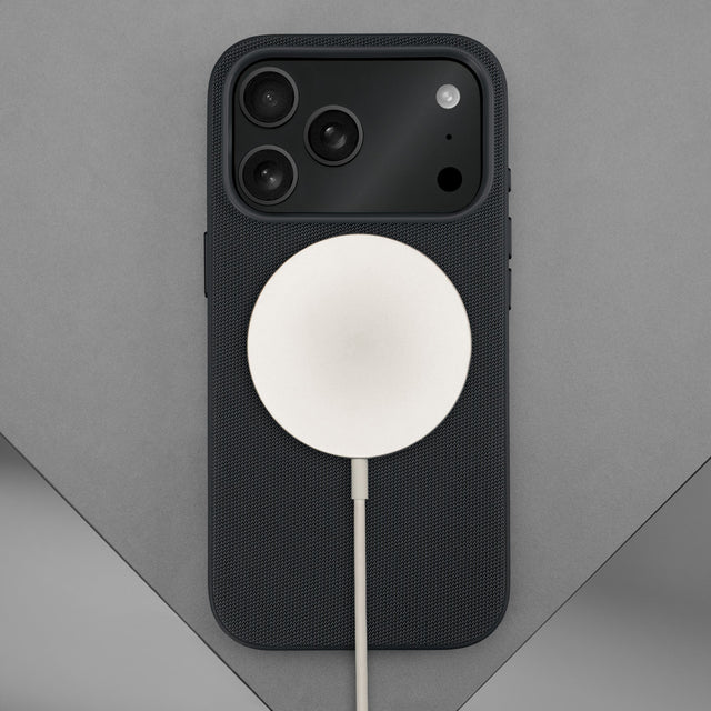Wireless charger attached to the Black Woven Texture Bumper Case for iPhone 17 Pro